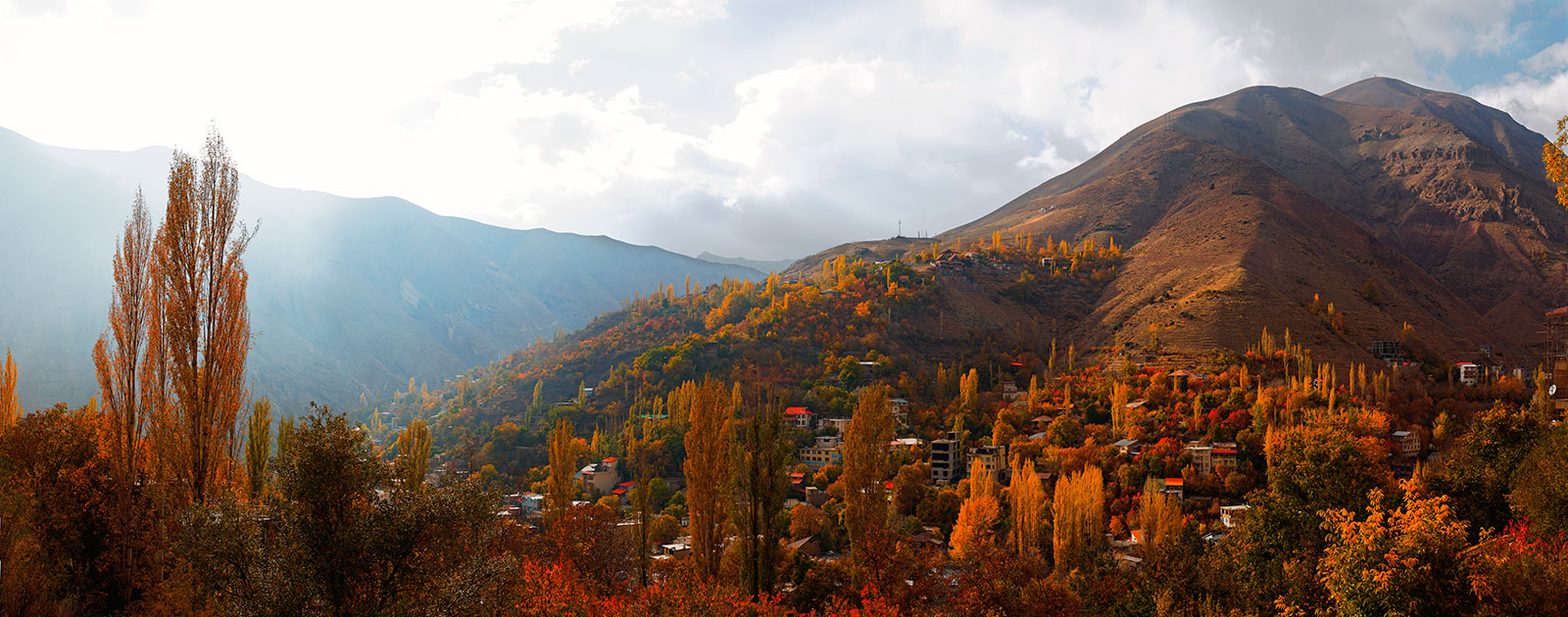 Panoramic view of colorful village composed of 9 exposures right to left by Tokina opera 50mm F1.4 FF at f/5.6 on Nikon D610 body at ISO50. Meygun, Iran.