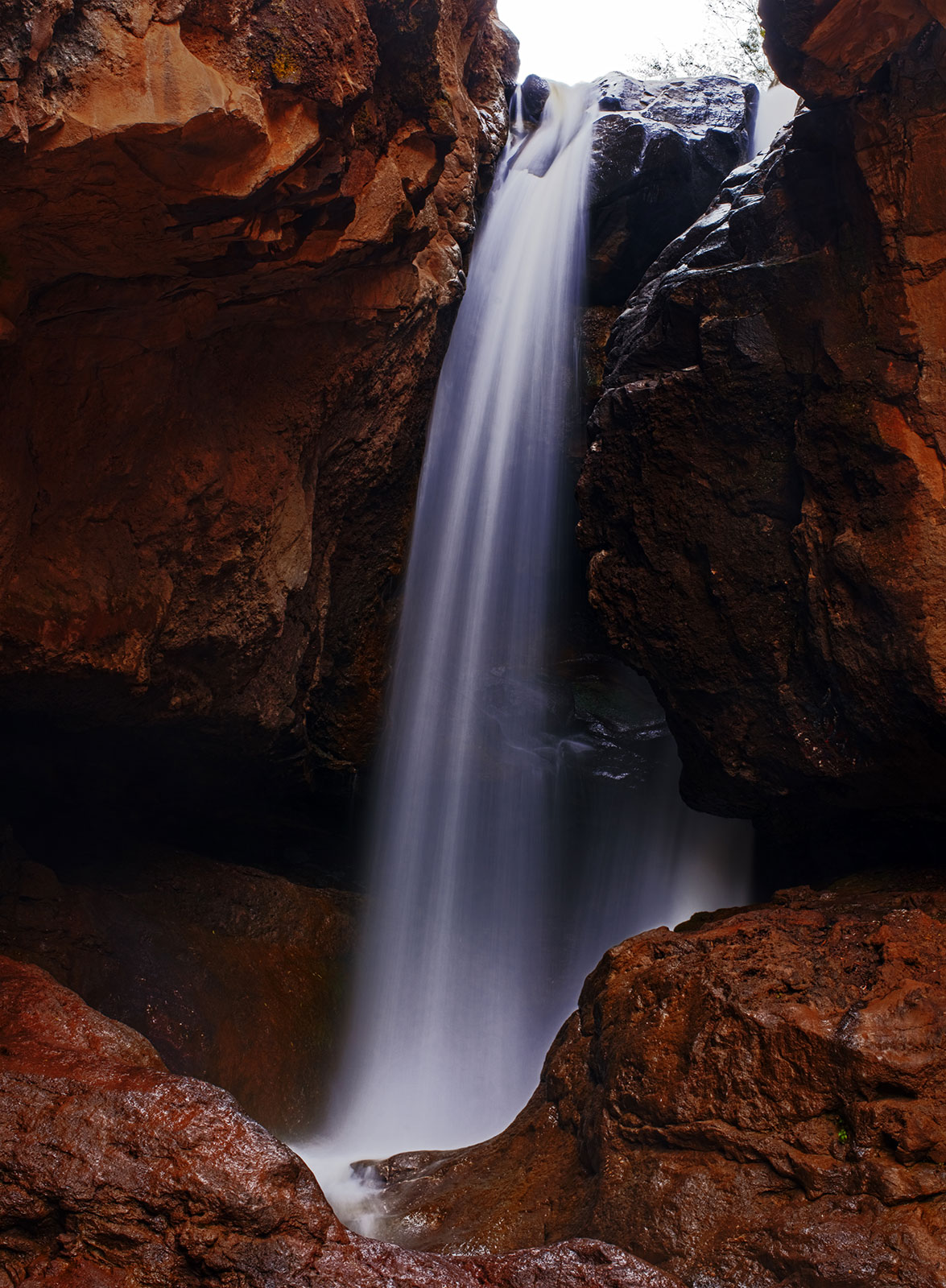 Karkabud waterfall. Under the strong sound of this waterfall you can hardly hear the sound of other people.  Like all rocks around, my opera 50mm lens was also covered by water droplets, but worked perfectly. This image is HDR composite of 5 images which are taken by Tokina opera 50mm F1.4 FF on D610 body.