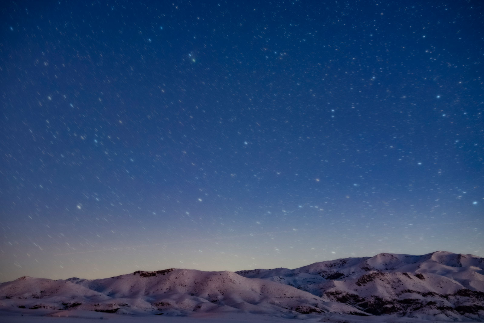 Results of stacking images with foreground layers atop. The result is a sharp out of noise foreground and blurred moving sky.